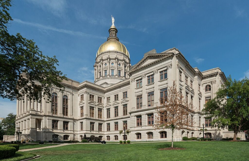Georgia State Capitol building exterior in Atlanta with gold dome visible.