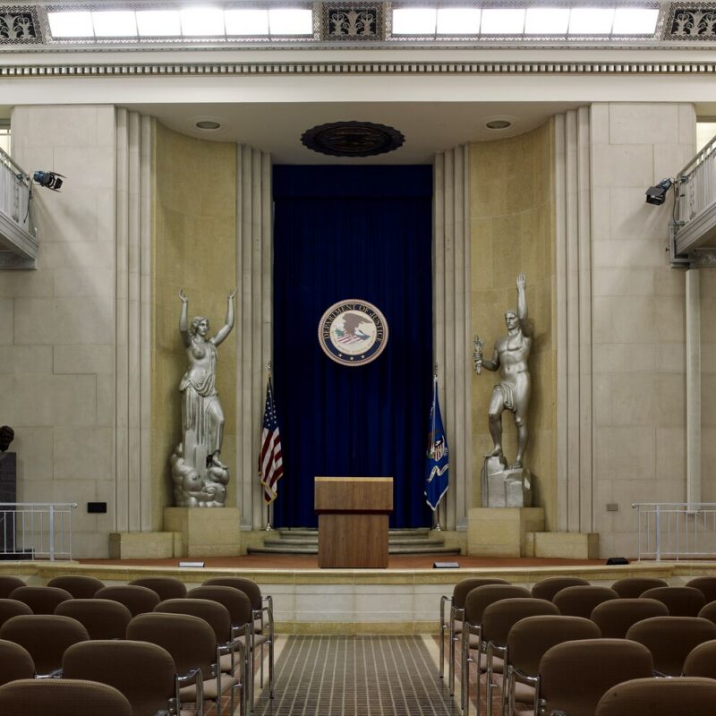 Two sculptures titled Spirit of Justice and Majesty of the Law displayed in the Great Hall of the U.S. Department of Justice in Washington, D.C.
